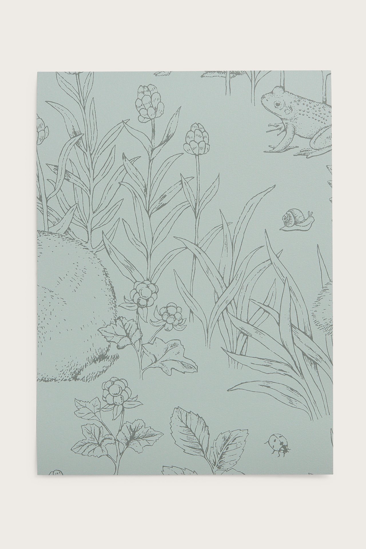 Front view of a light green wallpaper sample with a forest pattern, featuring animals, plants, and berries.