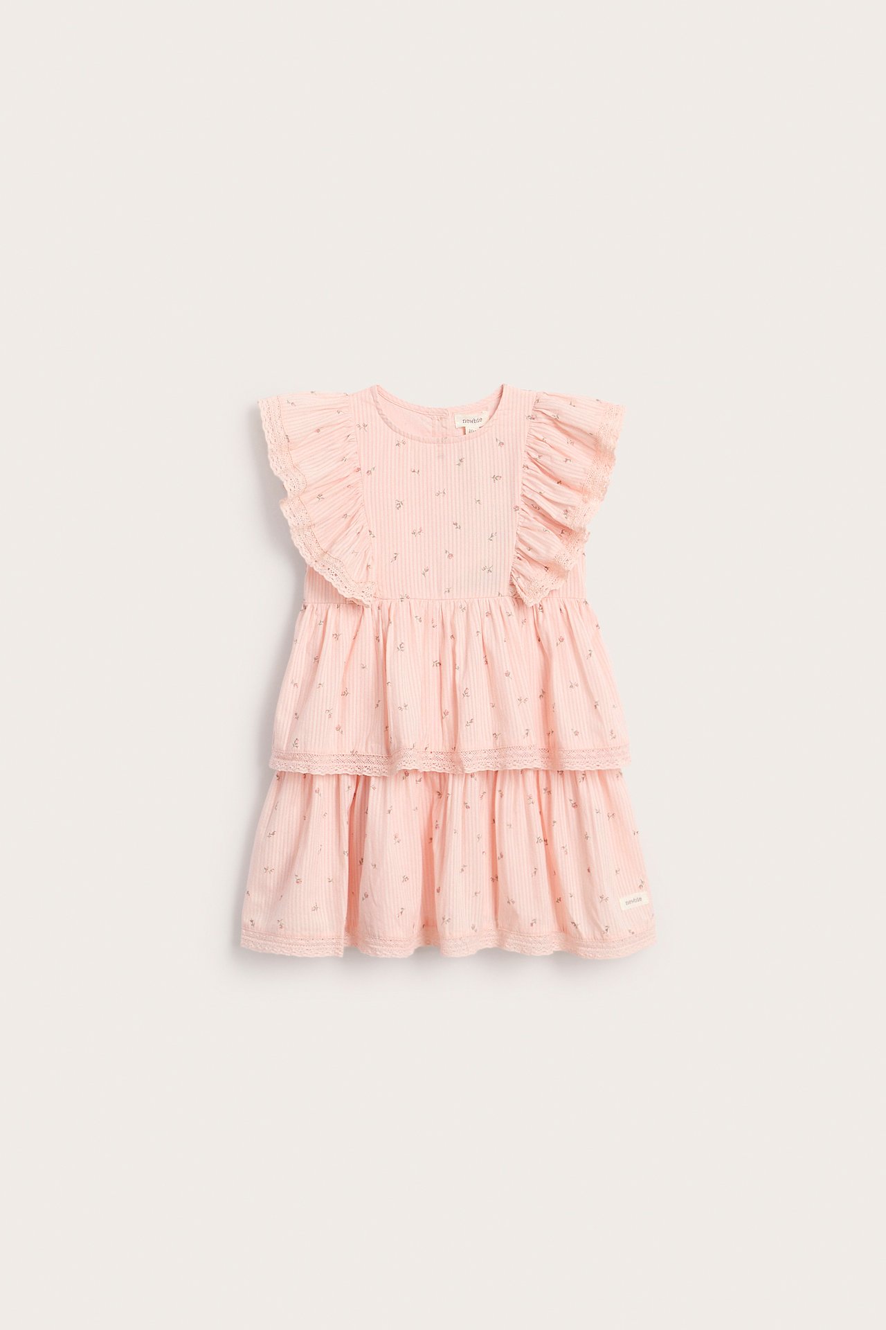 Front view of a kid's light pink floral tiered dress with ruffle sleeves, stripe texture, and lace edge details.