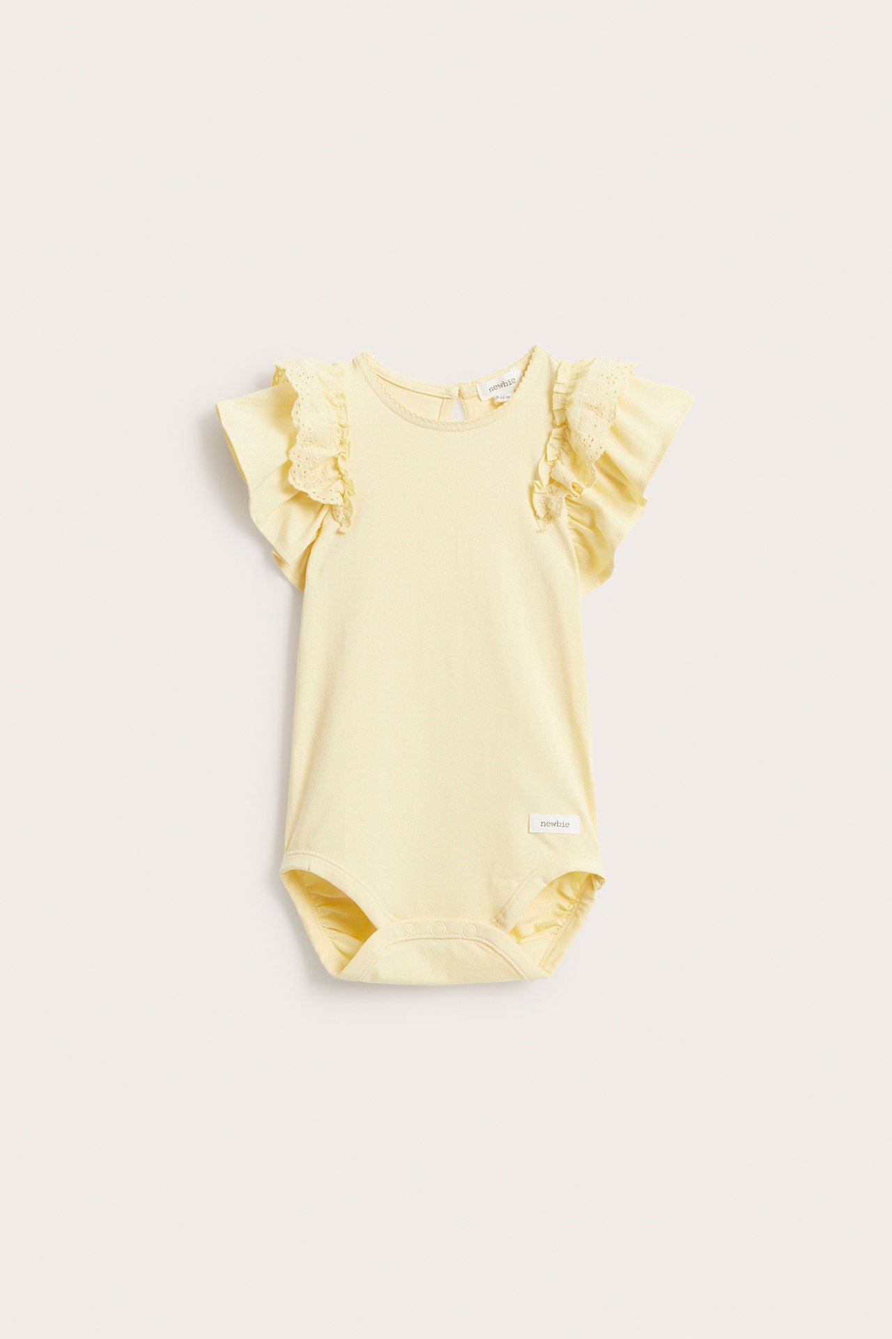 Front view of a baby's light yellow short-sleeved bodysuit with ruffle lace sleeves and snap buttons.