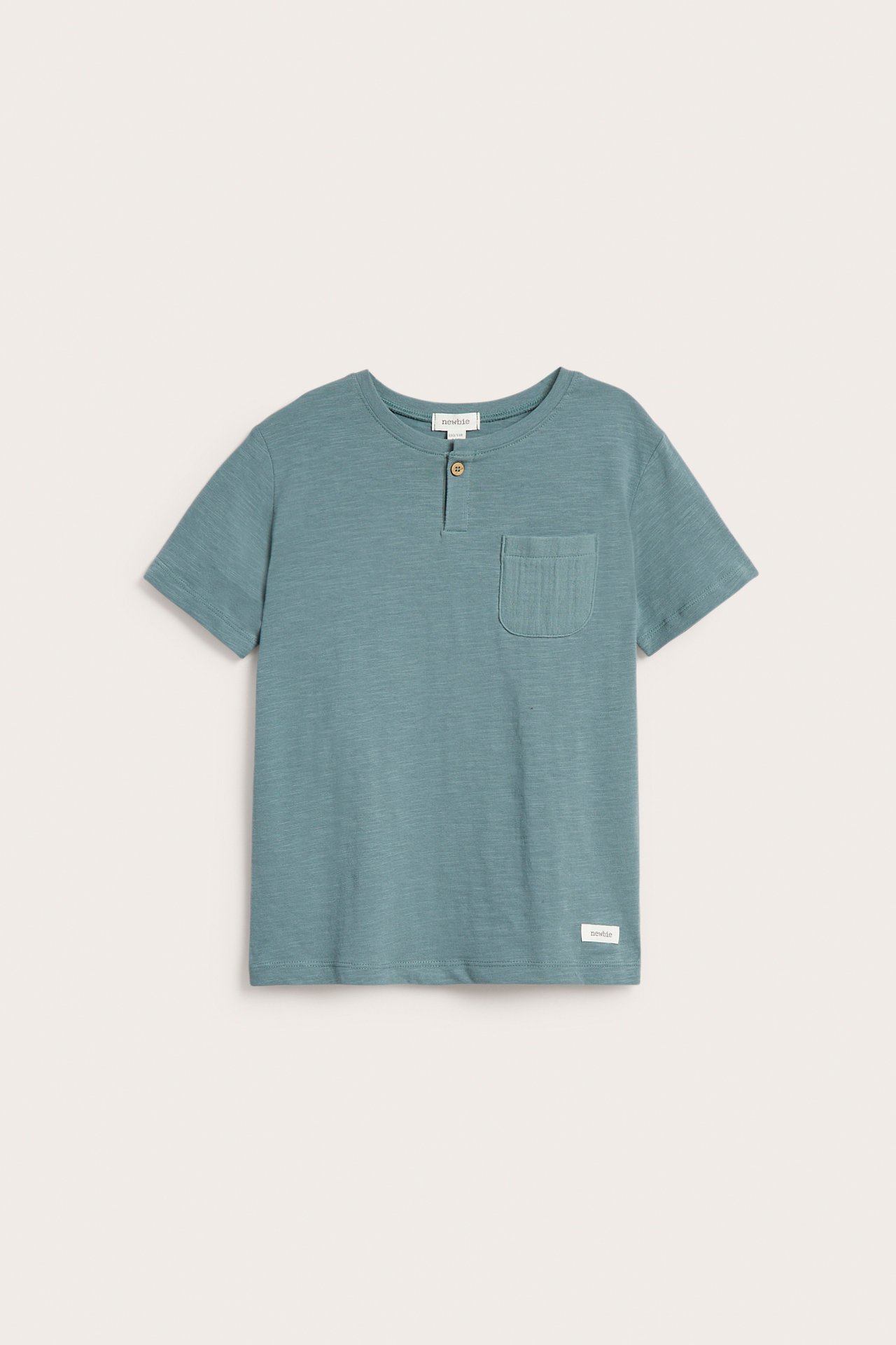 Front view of a kid's dark turquoise slub cotton t-shirt with a button placket and chest pocket.