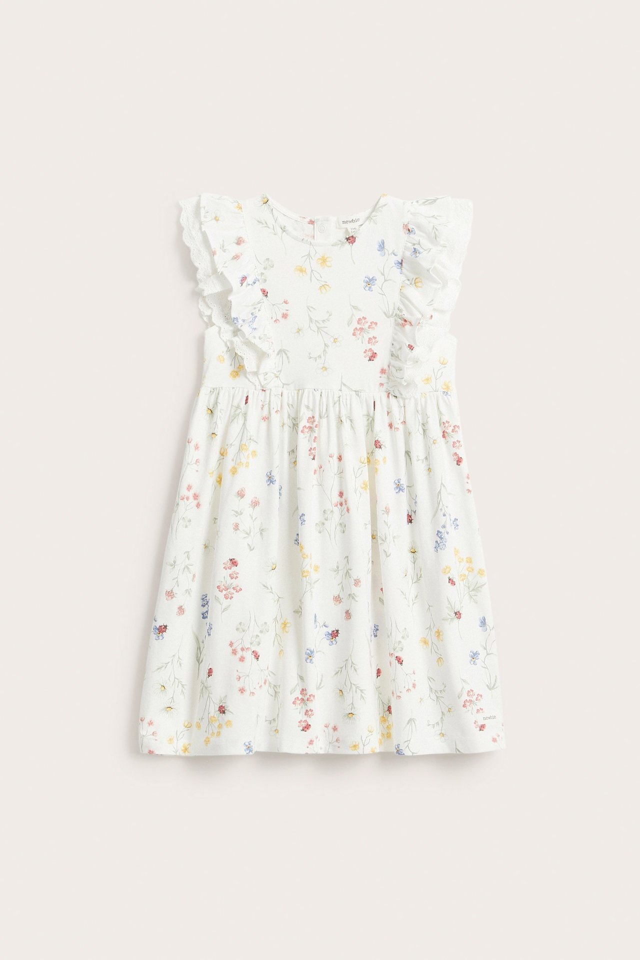 Front view of an off-white kid's floral jersey dress with ruffled, lace-trimmed sleeves.