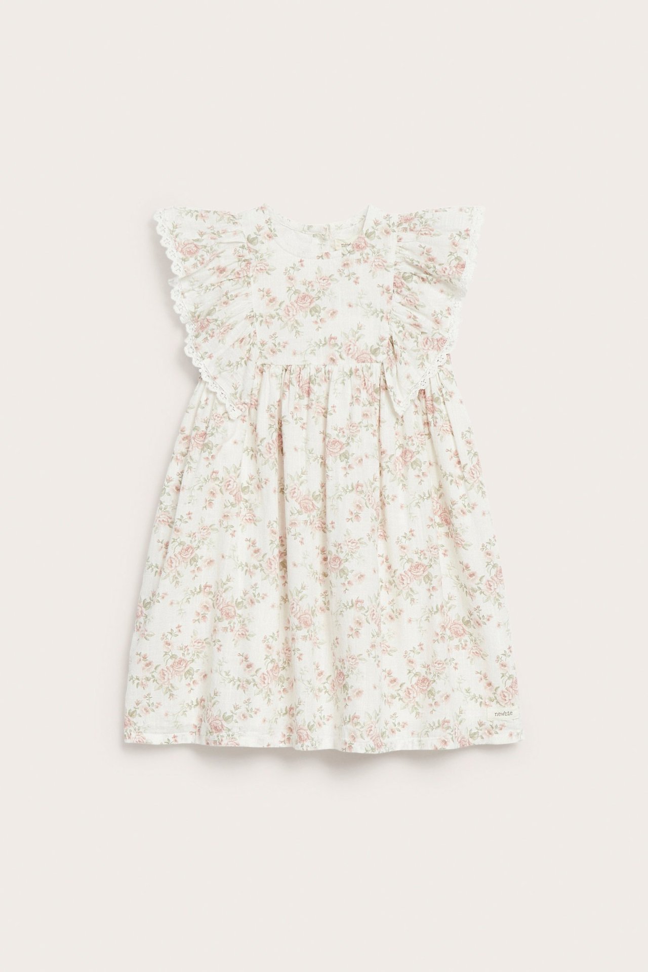 Front view of an off-white kid's dress with pink floral pattern, ruffled sleeves, and lace trim.