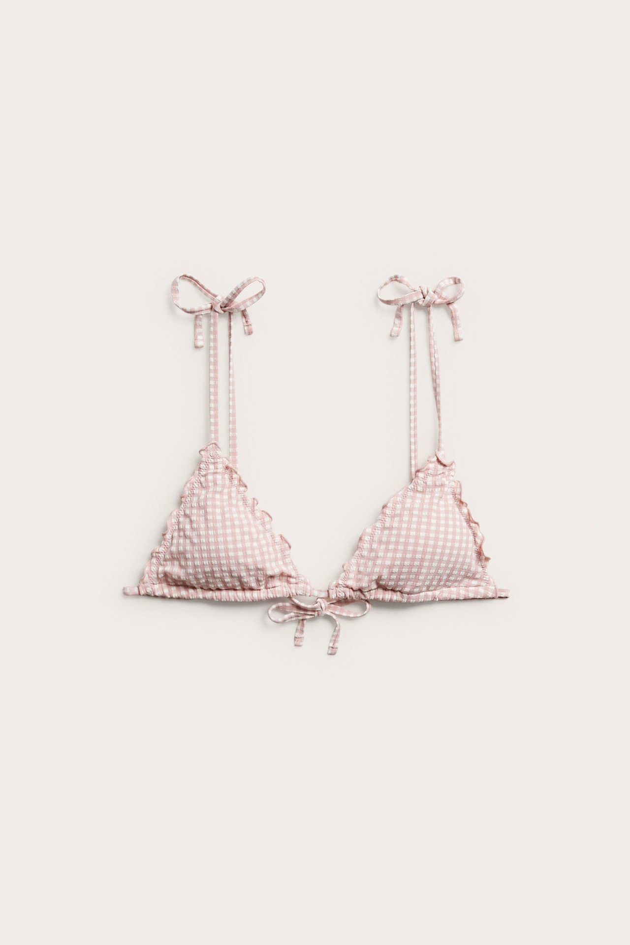 Vorderansicht eines Damen-Bikini-Tops in Rosa-Weiß mit Vichykaro-Muster, Rüschen und Bindebändern.