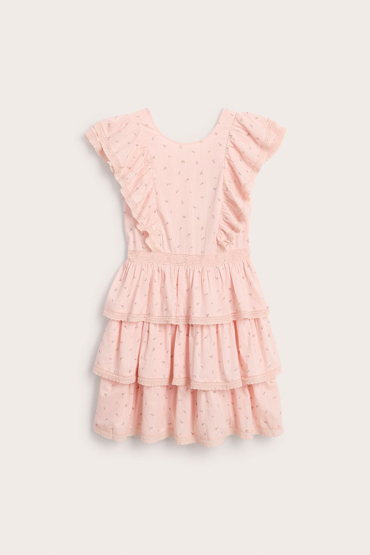 Front view of a light pink patterned woman's dress with ruffled sleeves and tiered skirt with lace trim.