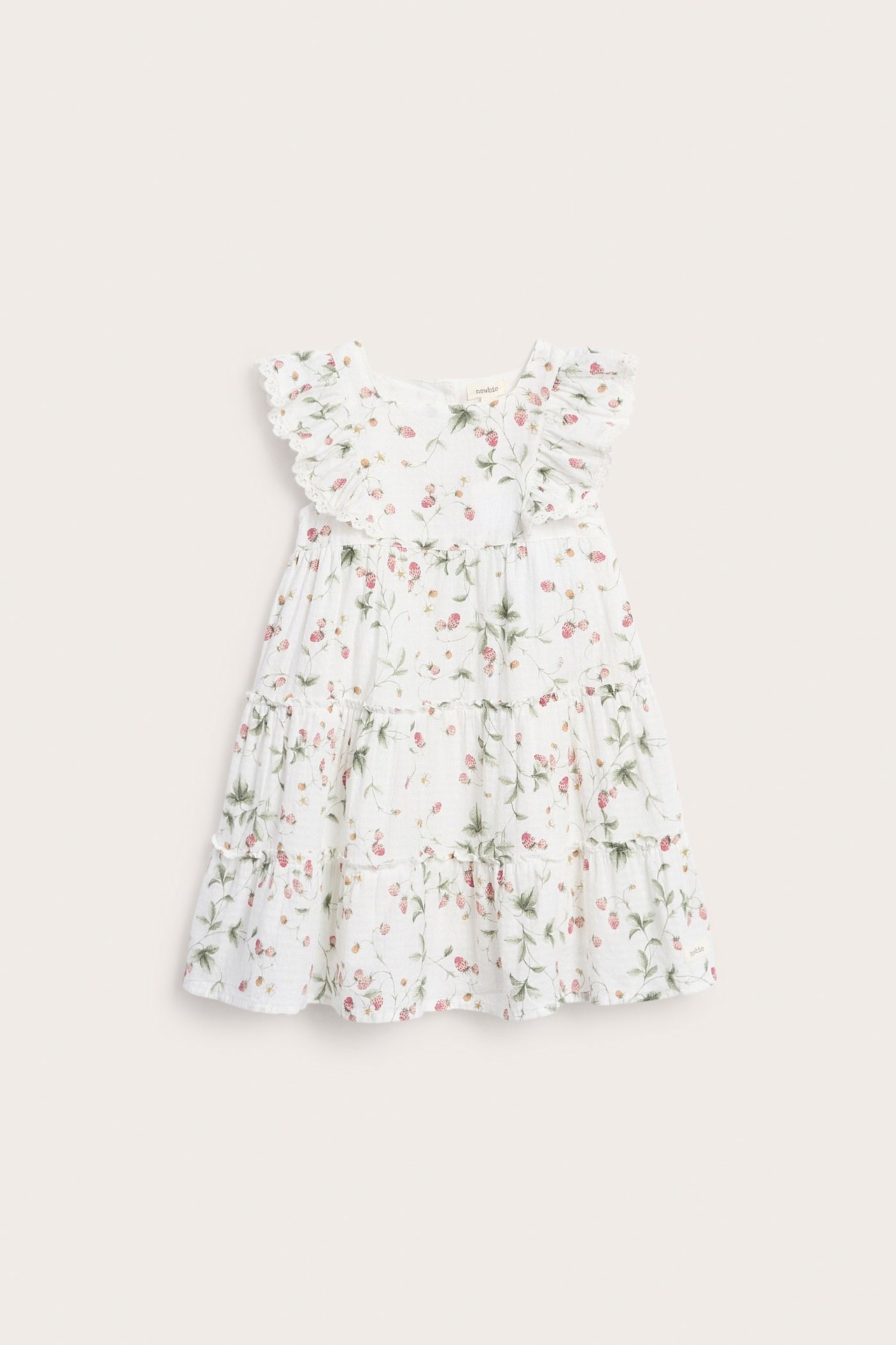 Vorderansicht: Kinderkleid in Offwhite, gewebt, mit Erdbeermuster, Rüschenärmeln, Spitze und Stufenrock.