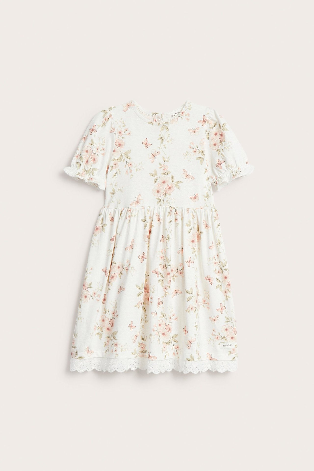 Front view: Off-white kid's cotton jersey dress with floral butterfly print, puff sleeves, and lace hem.
