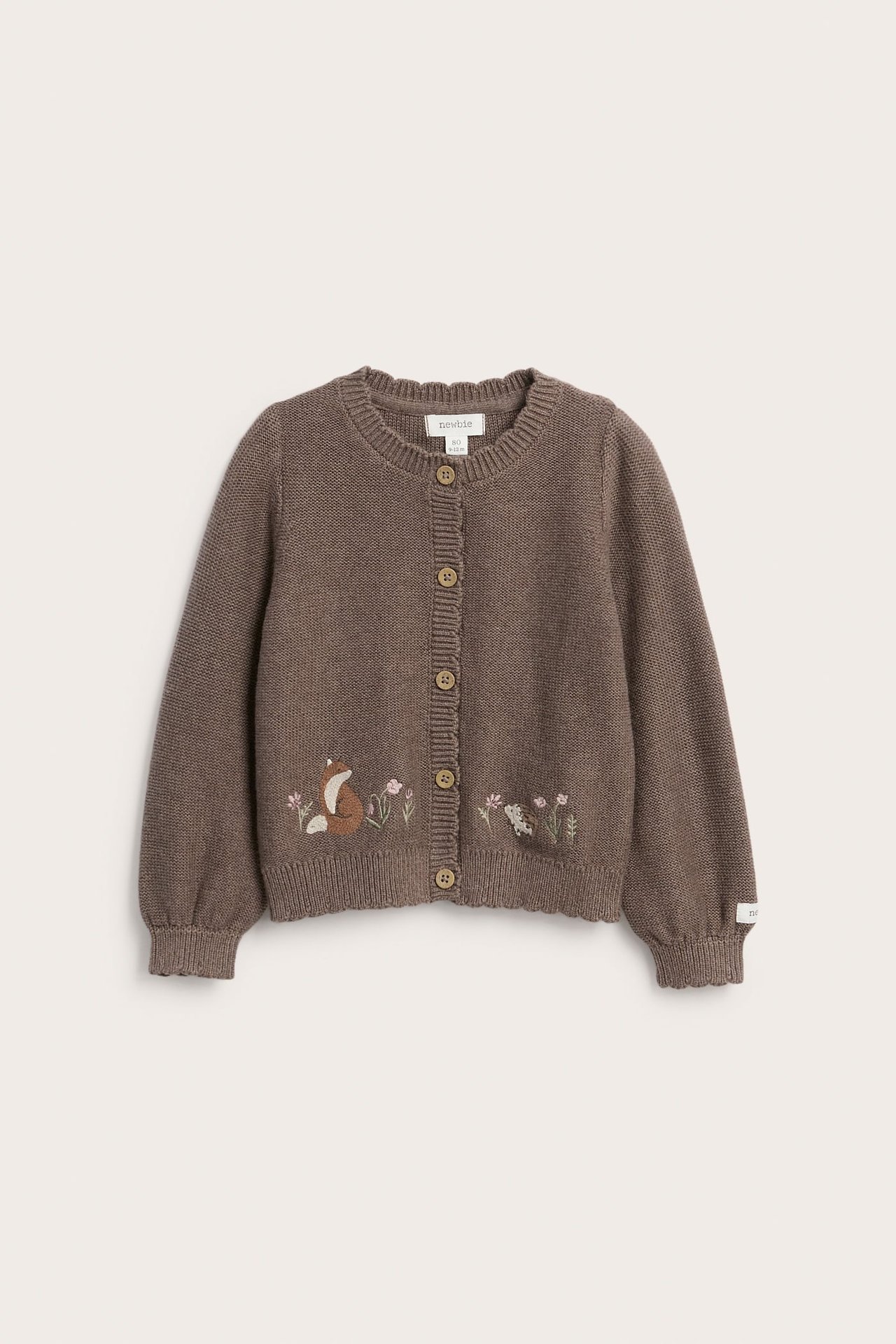 Front view of a kid's brown knitted cardigan with animal and floral embroidery and round buttons.