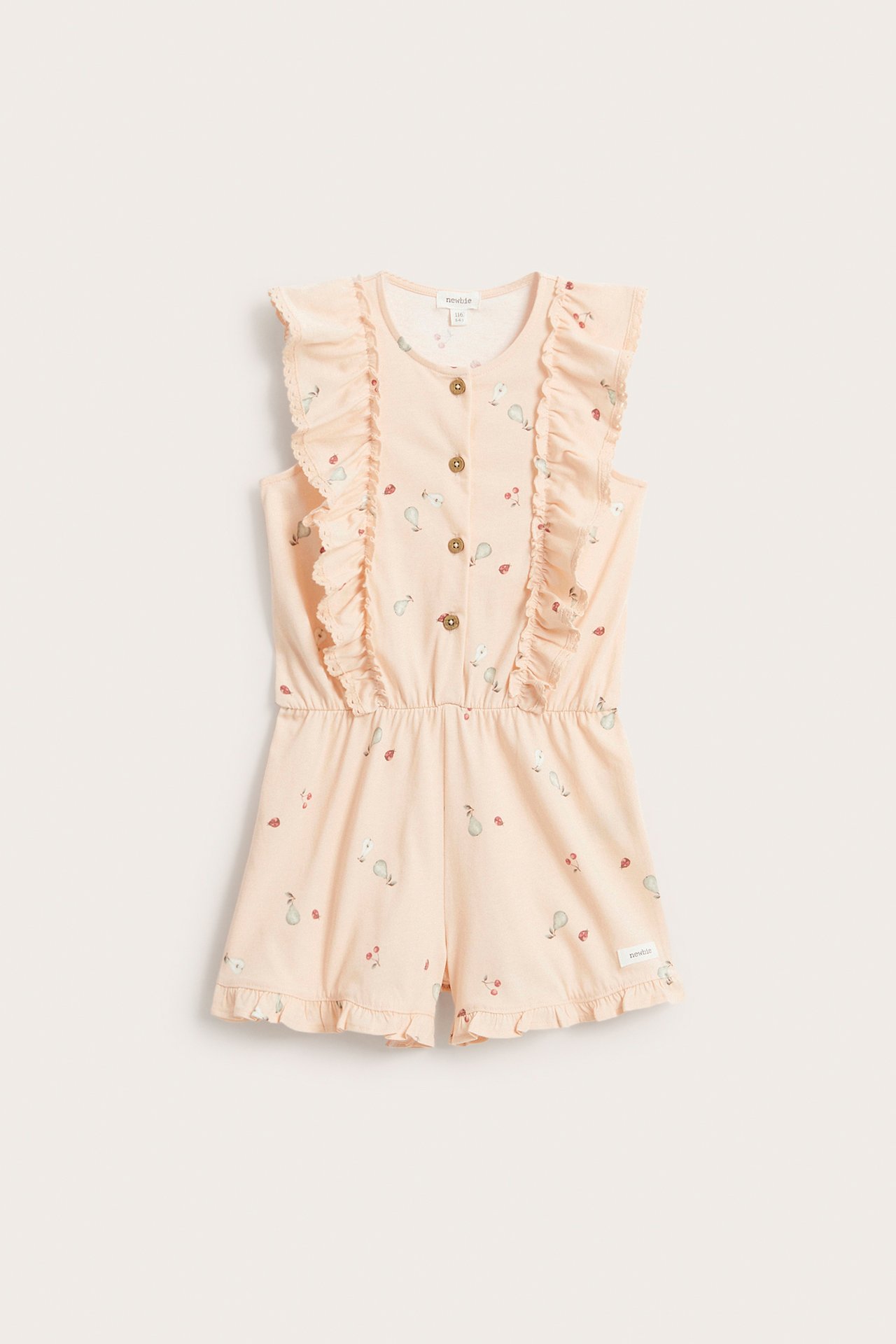 Front view of a kid's light orange patterned cotton jersey jumpsuit with ruffles and front buttons.