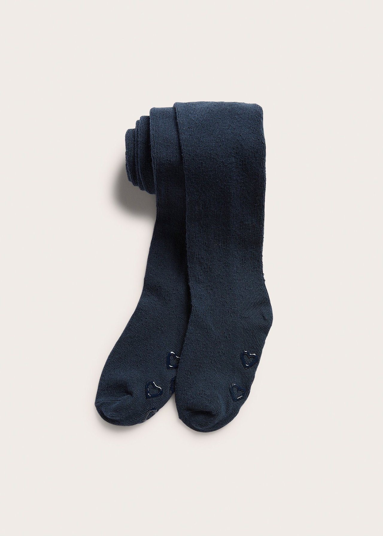 Front view: dark blue knit kid's tights with anti-slip heart grips on the soles.