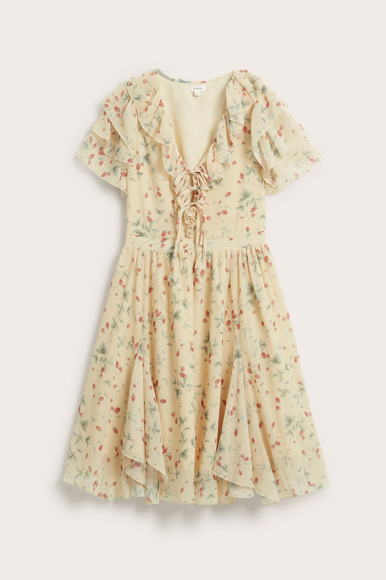 Front view: pale yellow chiffon dress with red berry pattern, ruffled v-neck, lace-up front, short ruffled sleeves.