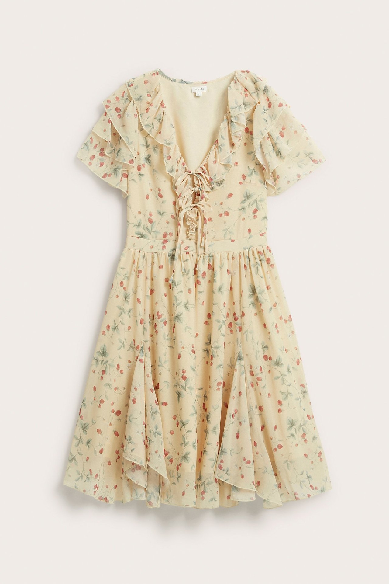 Front view: pale yellow chiffon dress with red berry pattern, ruffled v-neck, lace-up front, short ruffled sleeves.