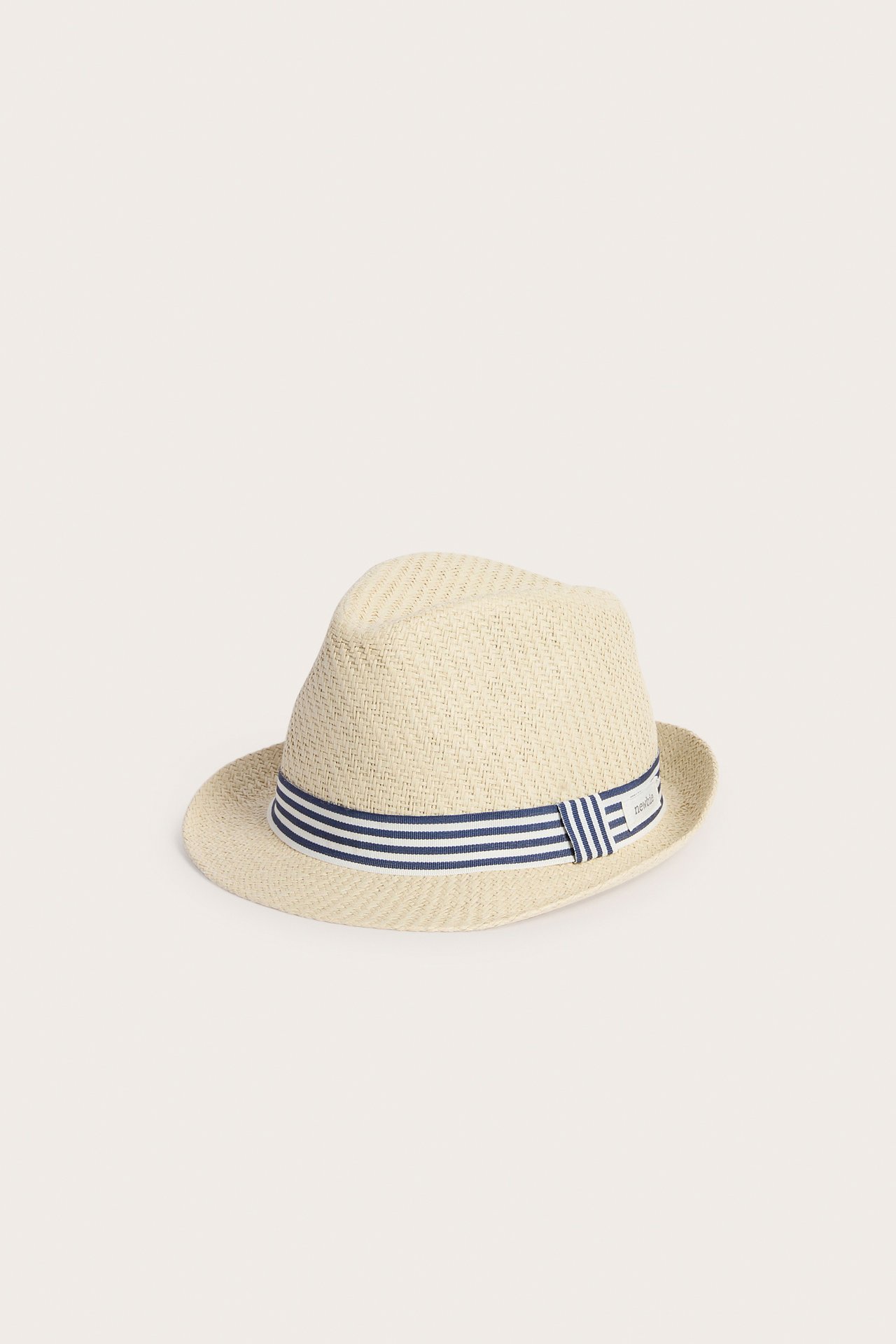 Front view of a light beige straw hat with a blue and white striped band.