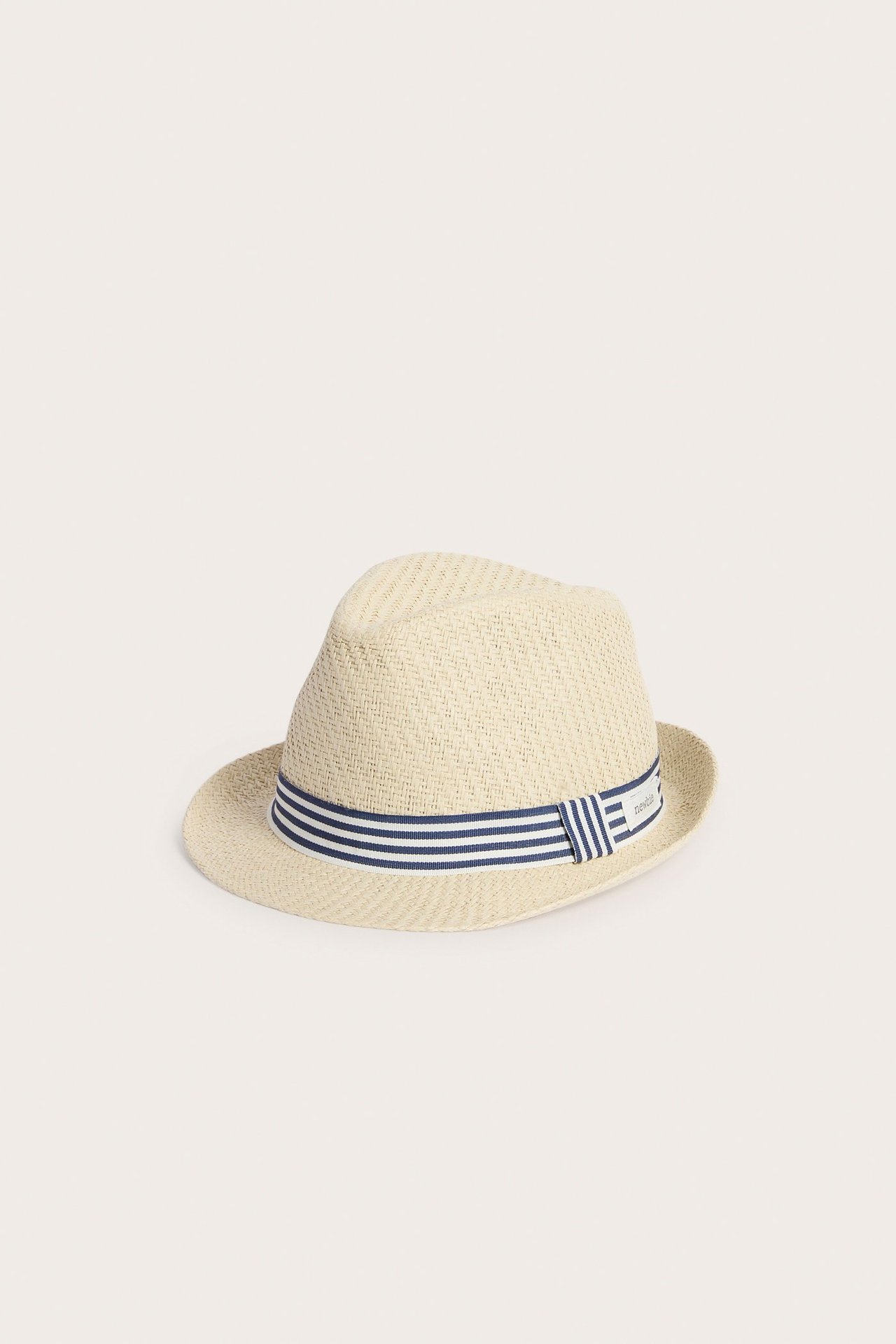 Front view of a light beige straw hat with a blue and white striped band.