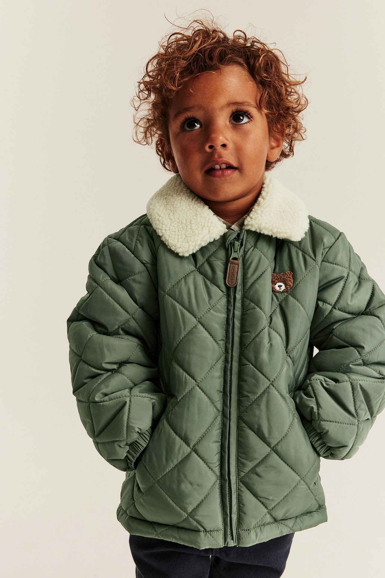 Quilted jacket with pile collar