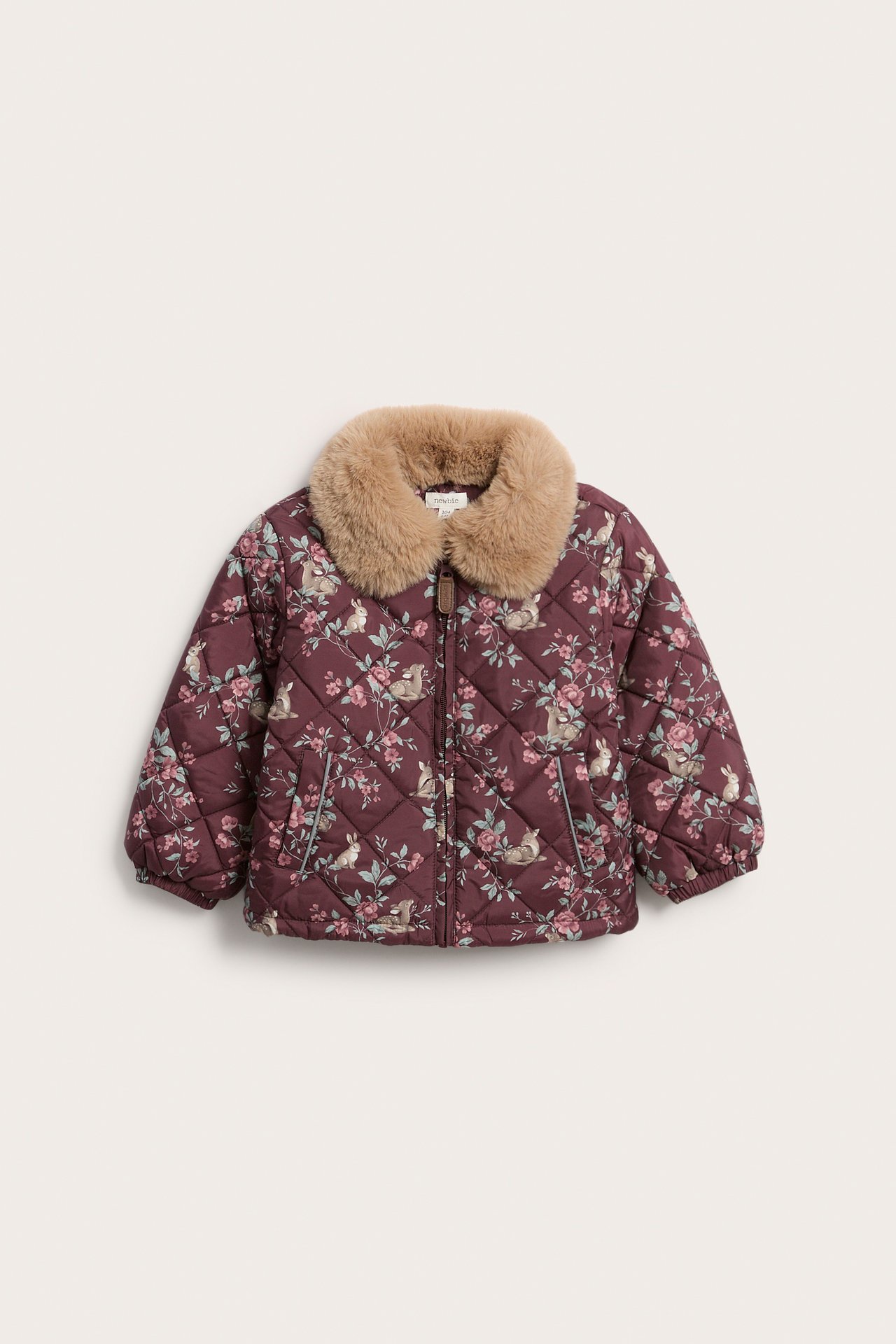 Front view: Kid's wine red quilted jacket with floral, rabbit print, light brown faux fur collar, and zip.
