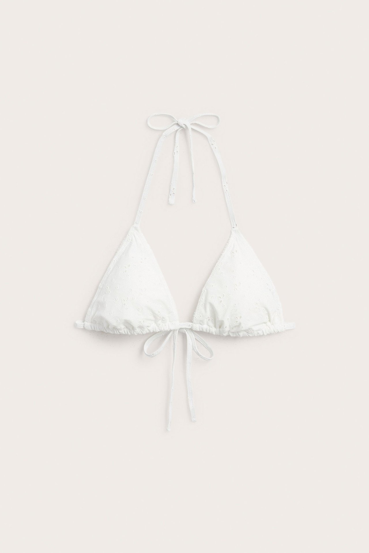 Front view: Off-white embroidered triangle bikini top with scalloped edge, tying at neck and back.