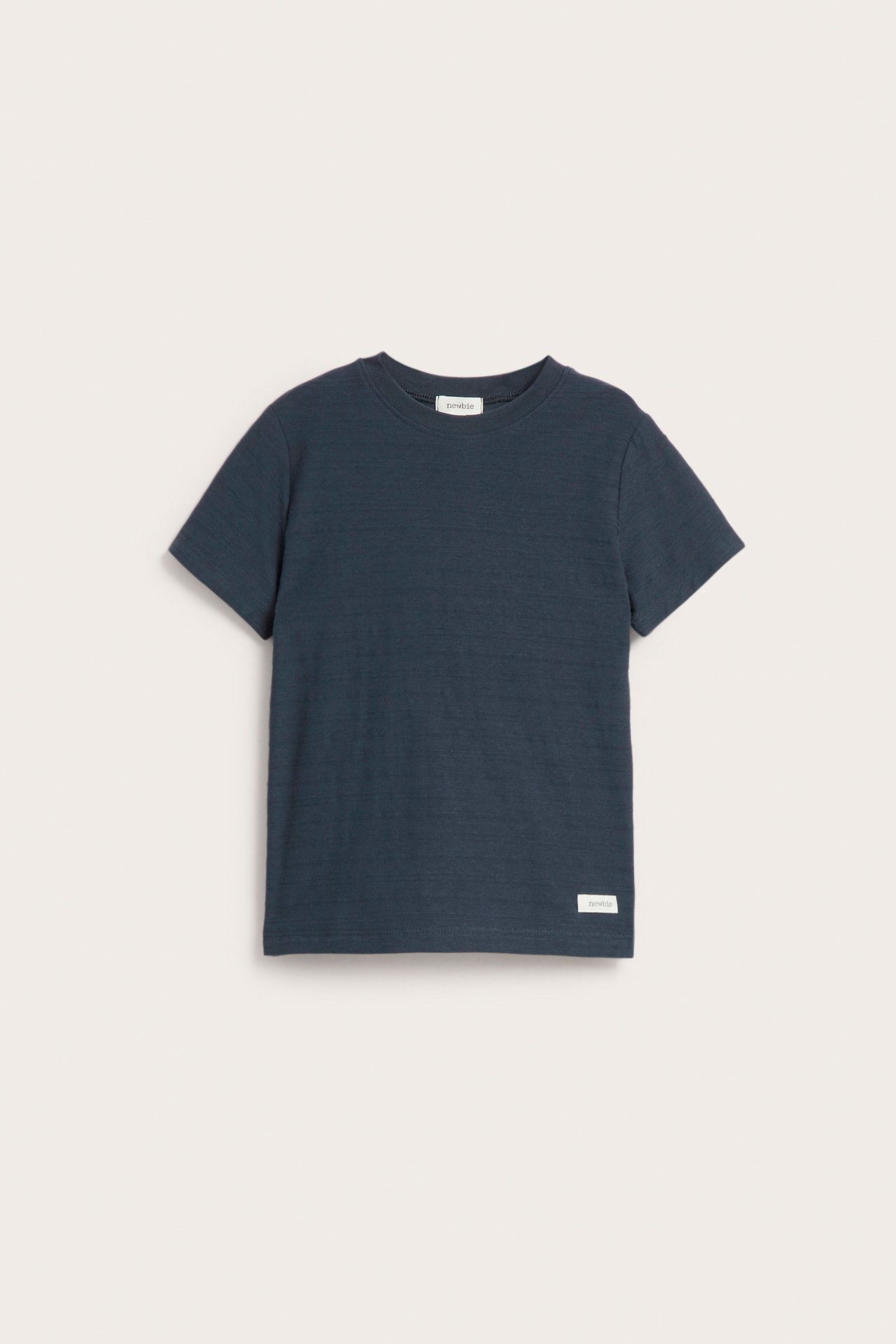 Front view of a kid's dark blue textured short-sleeved t-shirt with a round neck.