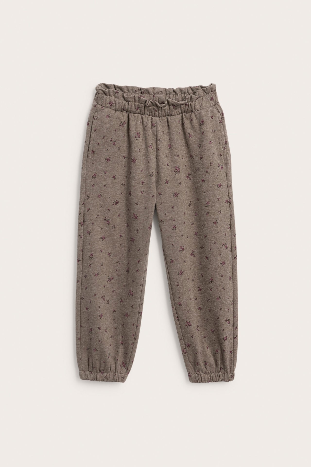 Vorderansicht von braunen geblümten Kinder-Sweatpants mit Gummizug an Taille und Bündchen.