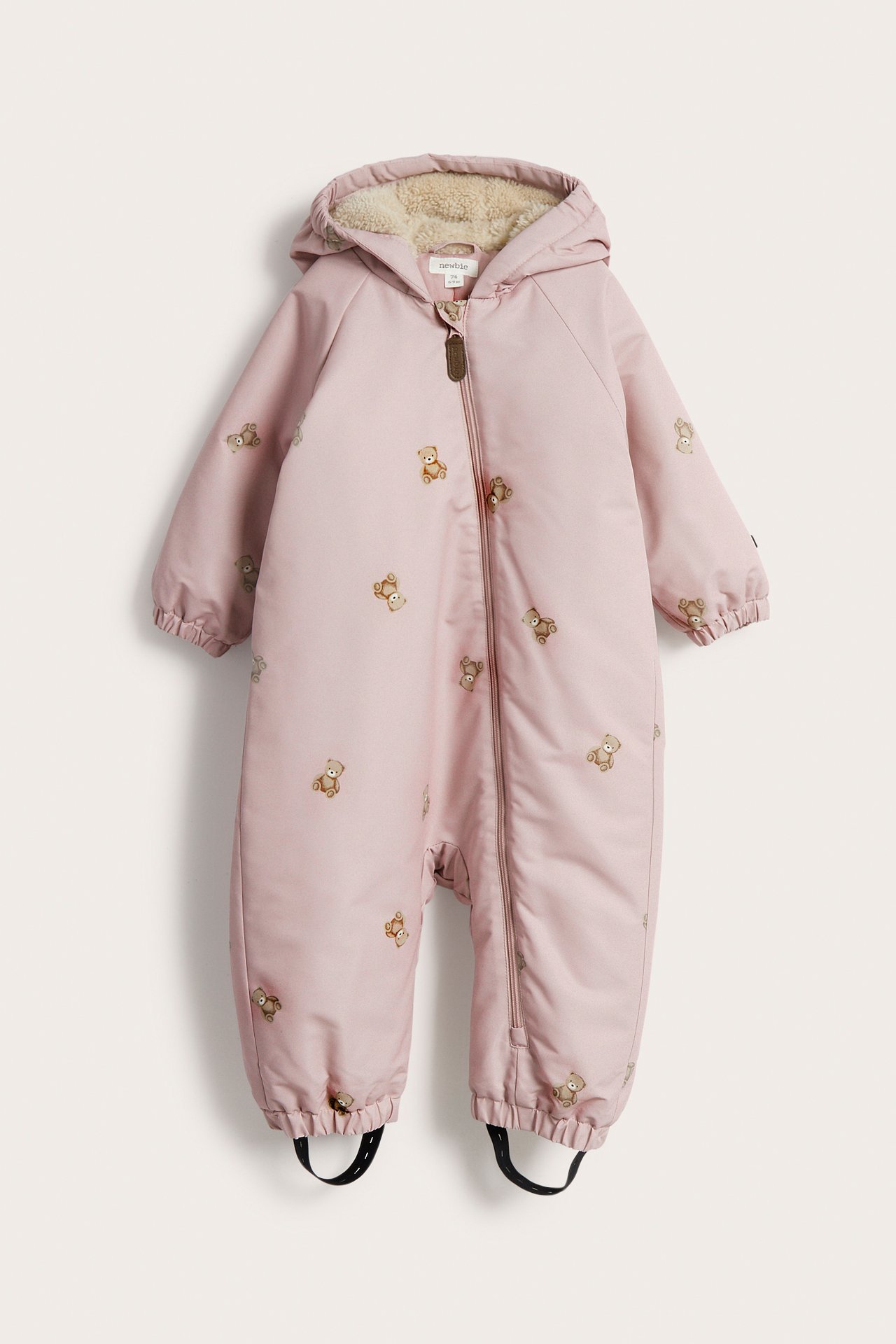 Front view of a pink baby hooded overall with teddy bear print and a full-length zipper.