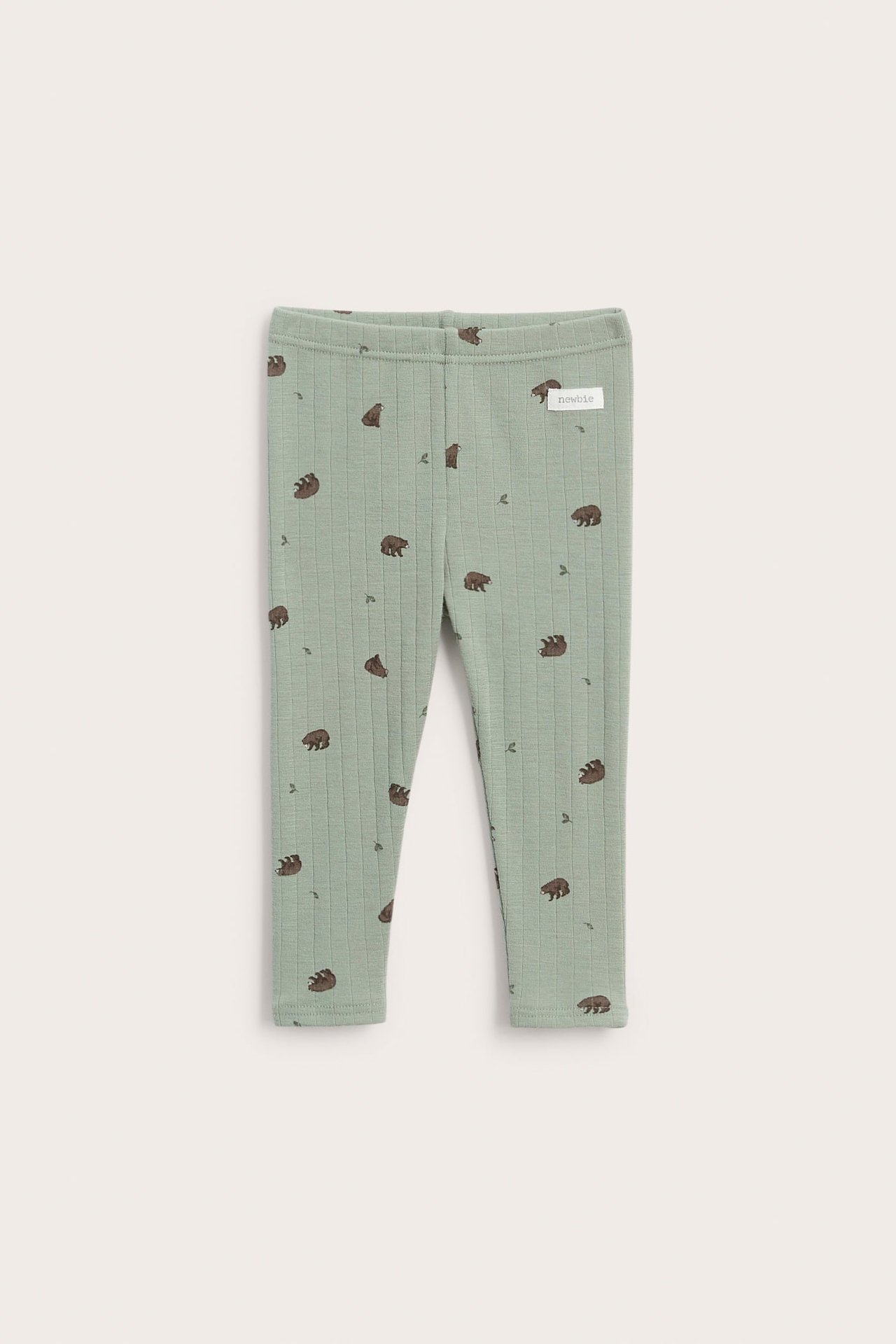Front view of ribbed green kid's leggings with brown bear print.