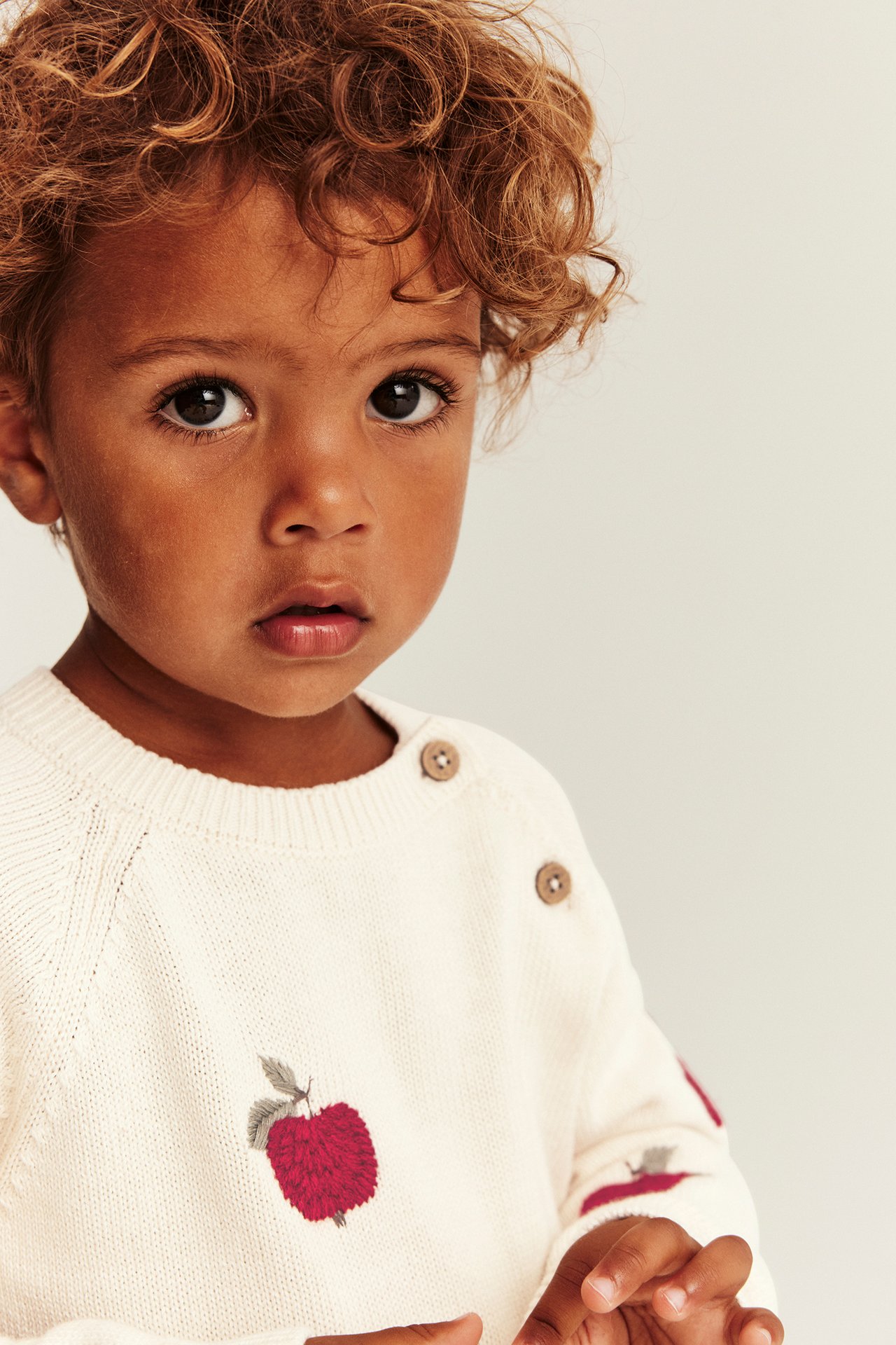 Knitted jumper with apple pattern