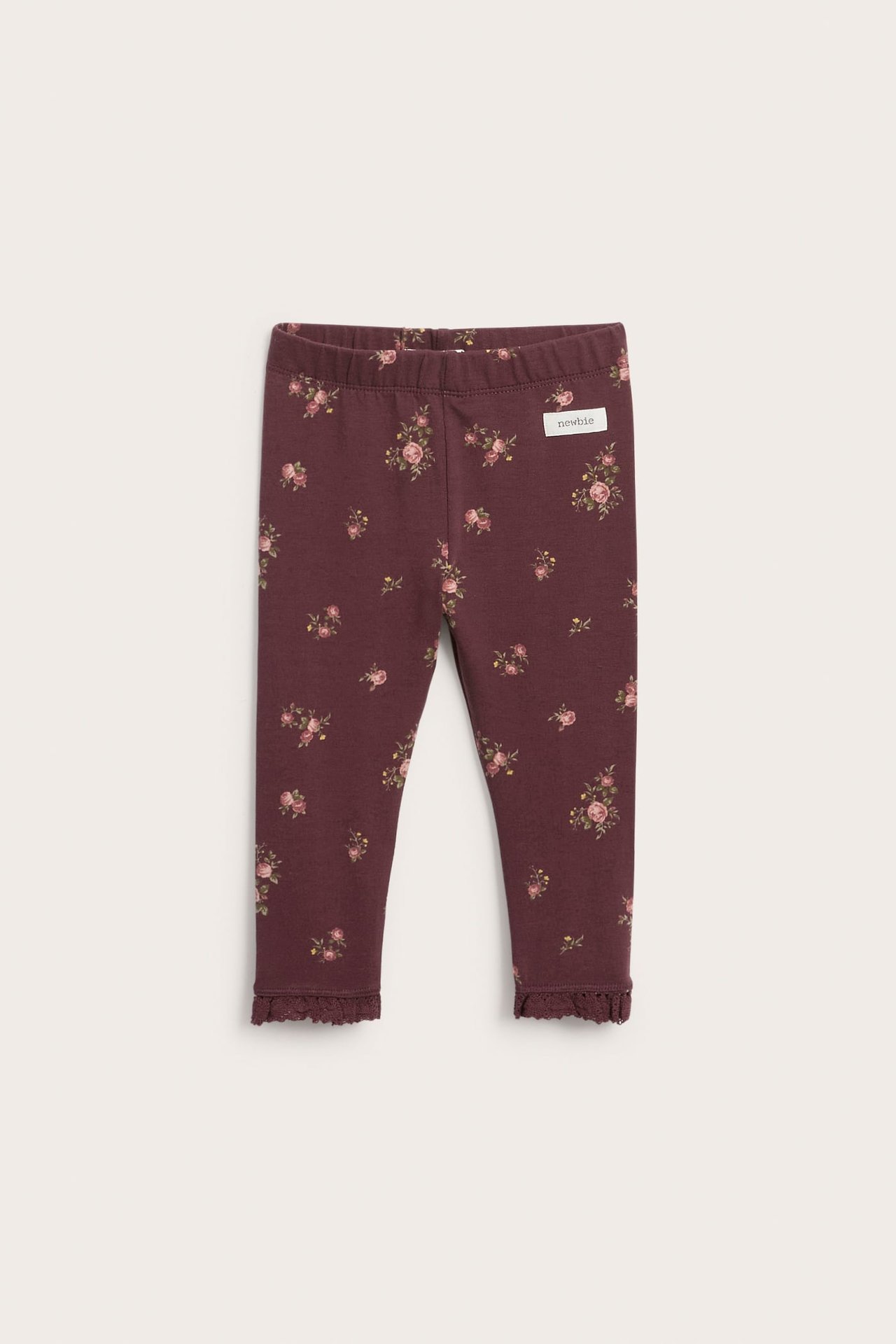 Vorderansicht dunkelroter geblümter Baby-Leggings mit Rüschensaum.