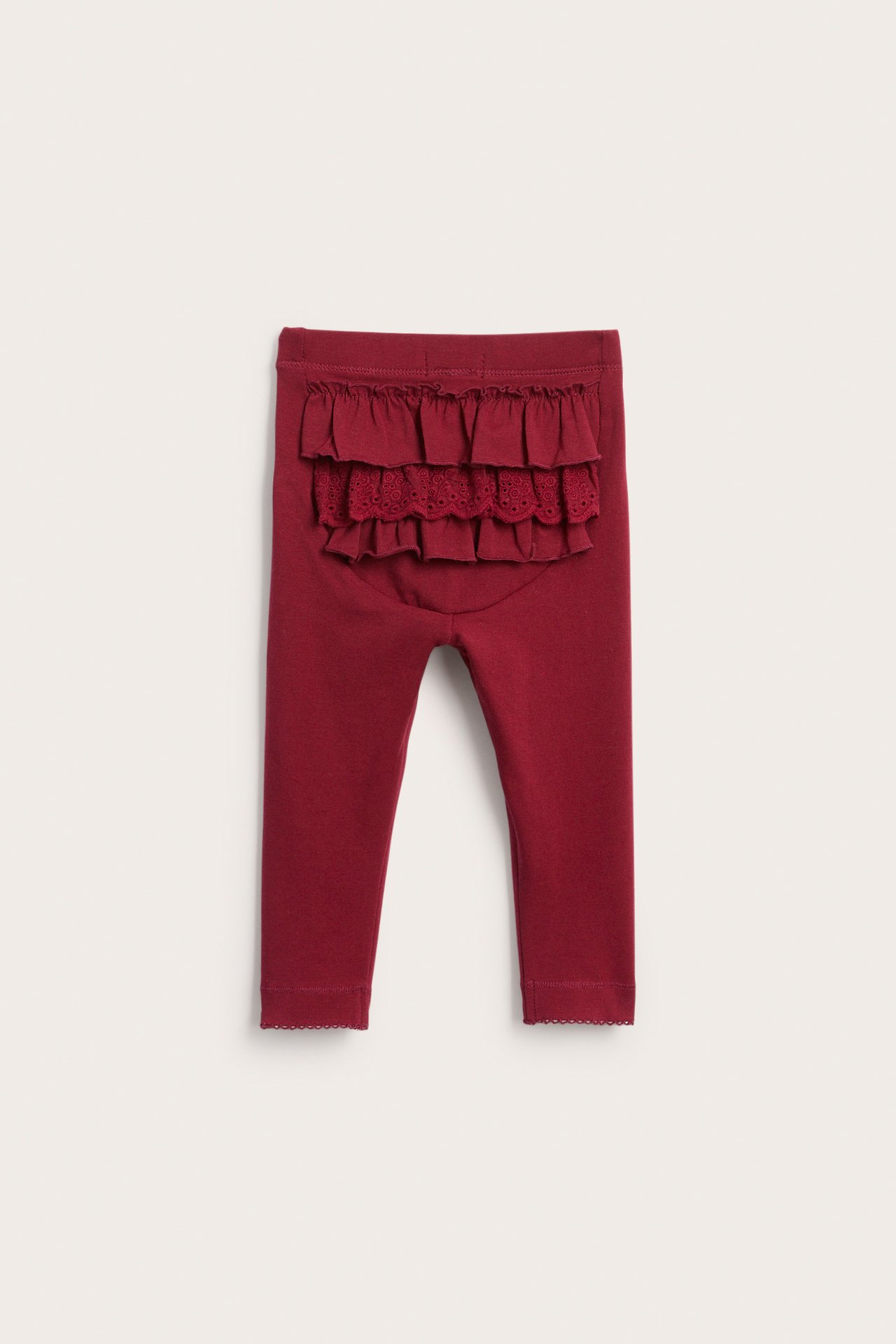 Back view of baby burgundy leggings with ruffles and lace detail.