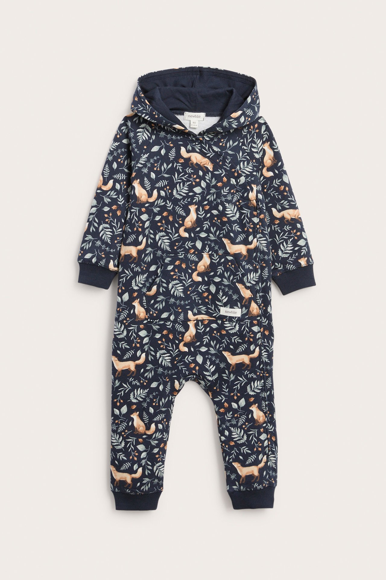 Front view of a dark blue baby hooded jumpsuit with fox and leaf print and kangaroo pocket.
