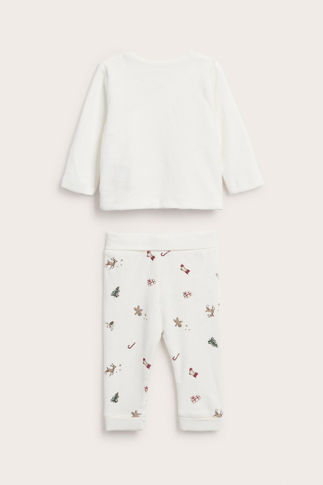 Vorderansicht eines weißen Baby-Loungewear-Sets mit unifarbenem Langarmshirt und gemusterten Weihnachtsleggings.