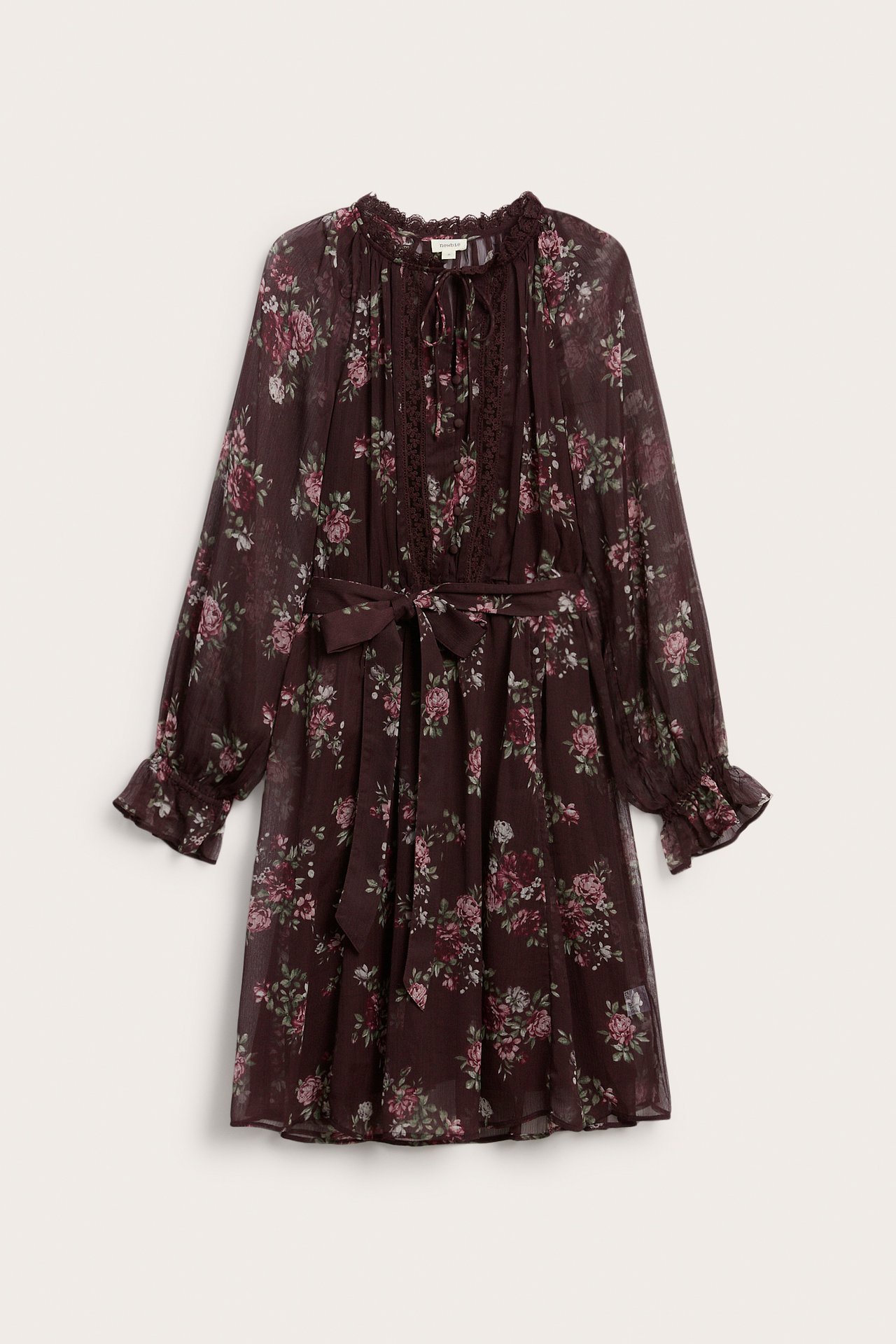 Front view of a dark maroon floral print long-sleeved dress with a tie-neck and waist belt.