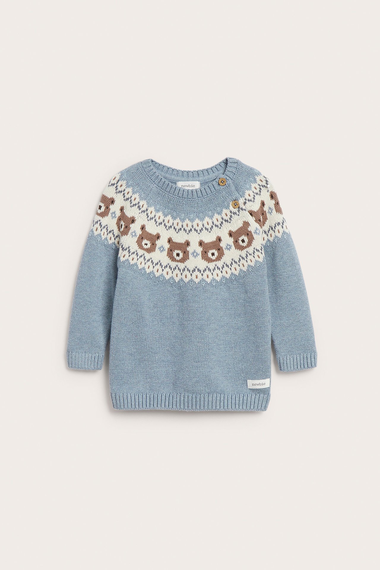 Front view of a baby's blue knitted sweater with a Fair Isle bear pattern and two buttons.