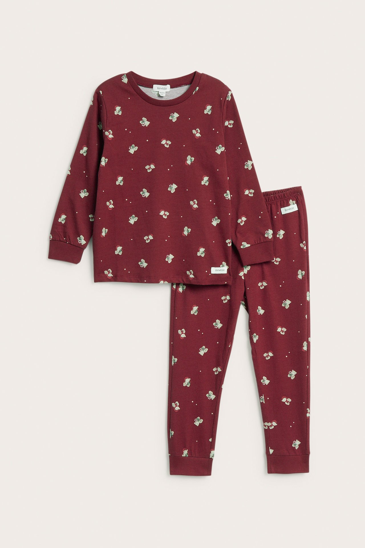 Vorderansicht eines burgunderfarbenen, langärmeligen Kinderpyjamas mit Blumenmuster.