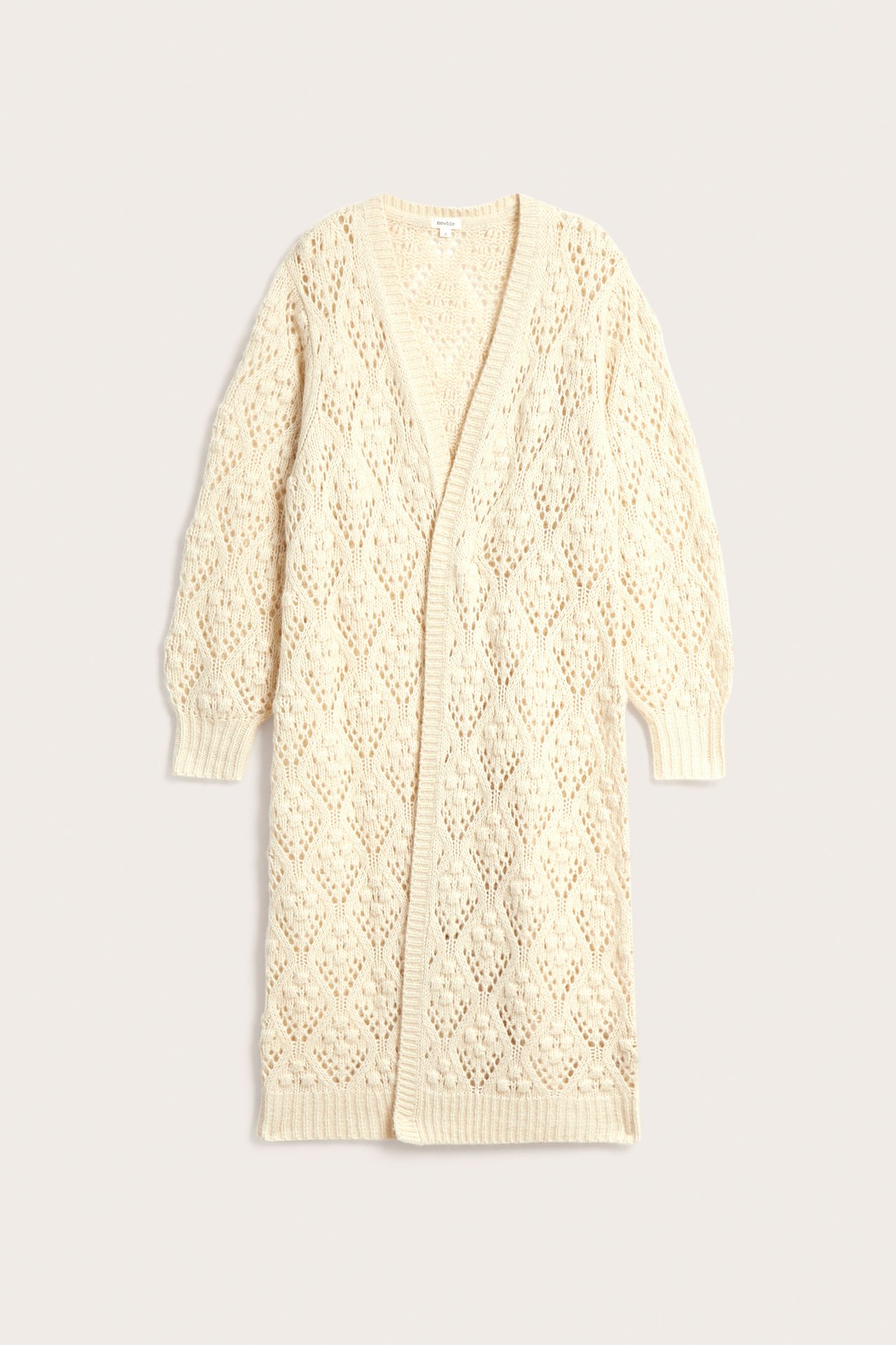 Front view of a long, cream open-knit cardigan with a diamond pattern and ribbed cuffs.