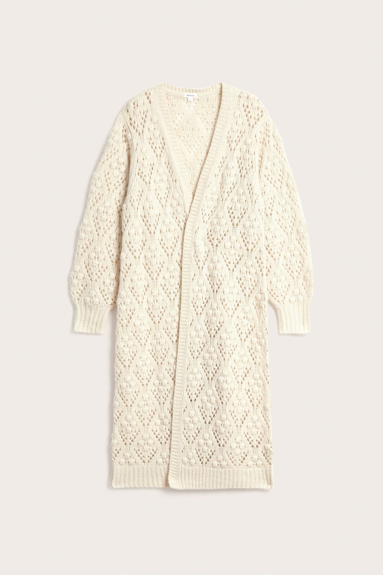 Front view of a long, cream open-front knitted cardigan with a diamond lace pattern.