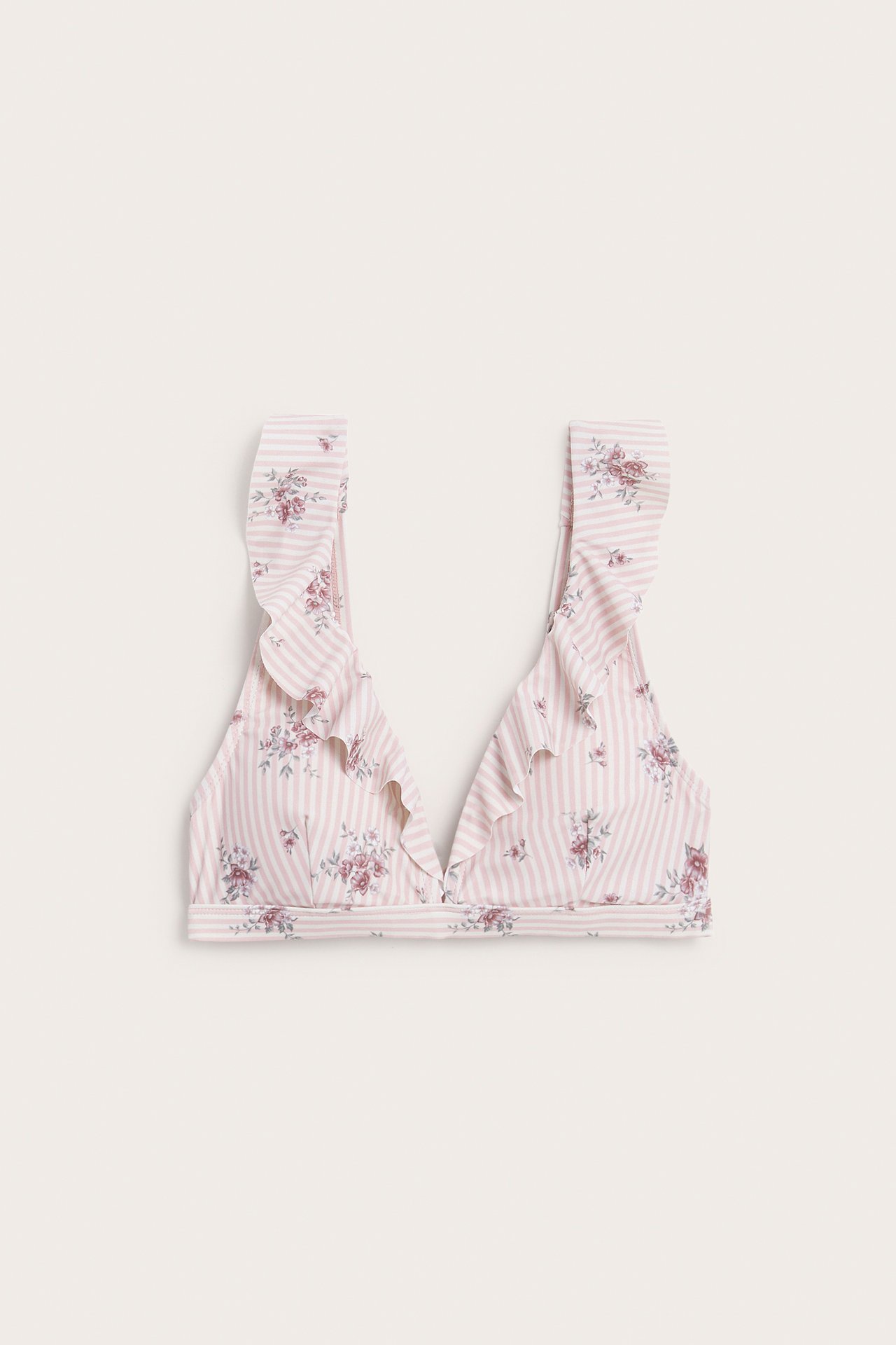 Front view of a pink and white striped floral bikini top with ruffles.