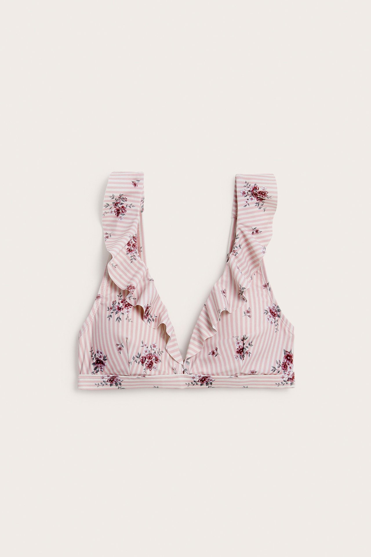 Front view of a pink and white striped floral ruffle bikini top.