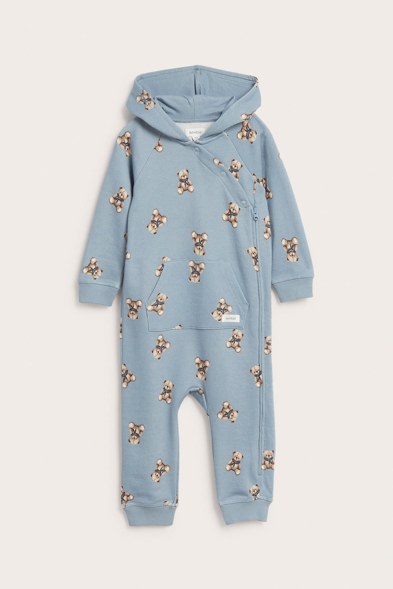 Front view of a baby's light blue hooded teddy bear print romper with snap buttons and side zipper.