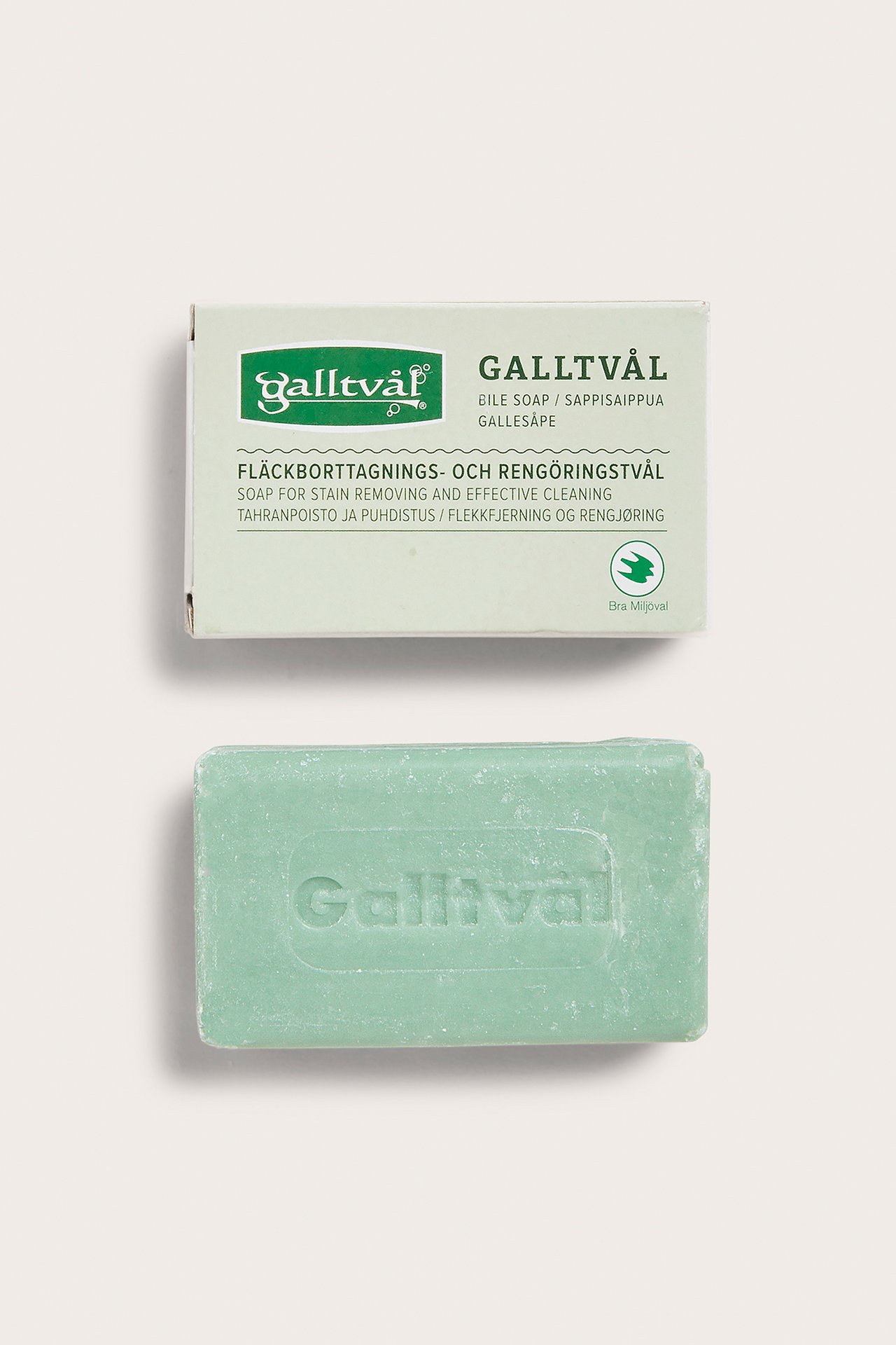 Top-down view of a rectangular green Galltvål soap bar and its light green and white packaging.